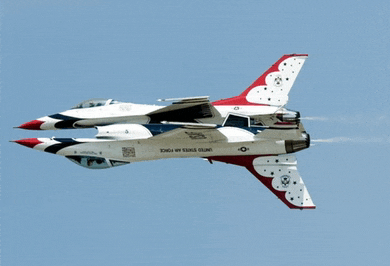 two united states air force fighter jets are flying in formation