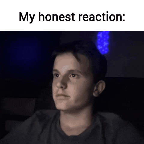 a man in a dark room with the words my honest reaction written above him