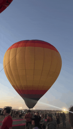 a hot air balloon is being launched in the sky