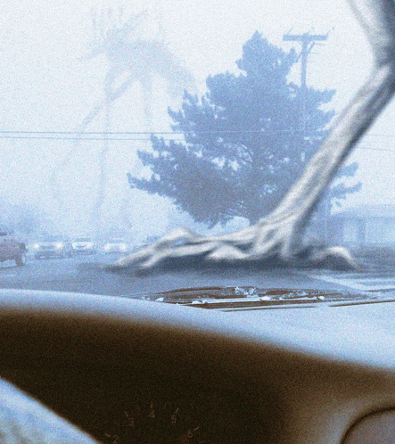 a car windshield with a tree in the background and the numbers 1 through 6 on the dashboard