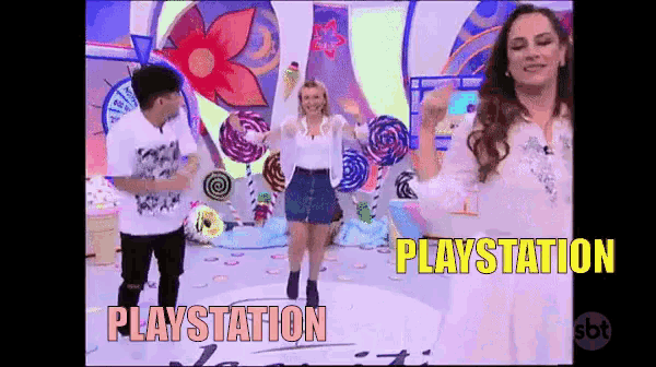 a man and a woman are dancing in front of lollipops and the word playstation is on the screen