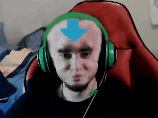 a man wearing headphones has a blue arrow pointing down on his forehead