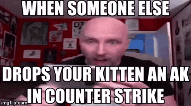a bald man is sitting in front of a computer with a meme on his face .