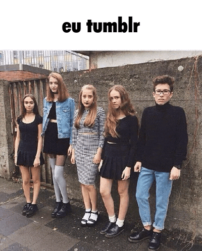 a group of young people standing in front of a wall with the words eu tumblr written above them