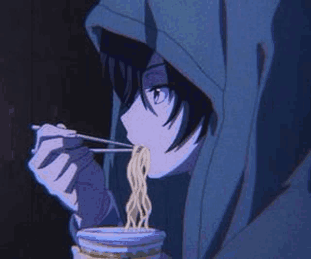 a person is eating noodles from a cup with chopsticks .