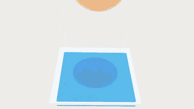 a yellow ball is sitting on top of a blue and white circle
