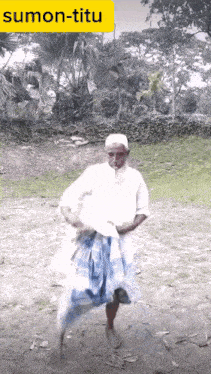 a man in a white shirt and blue skirt is dancing in a field with the word sumon-titu above him