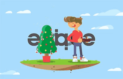 a boy is holding a remote control next to a christmas tree with a star on top of it