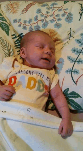 a baby wearing a shirt that says awesome like my dad