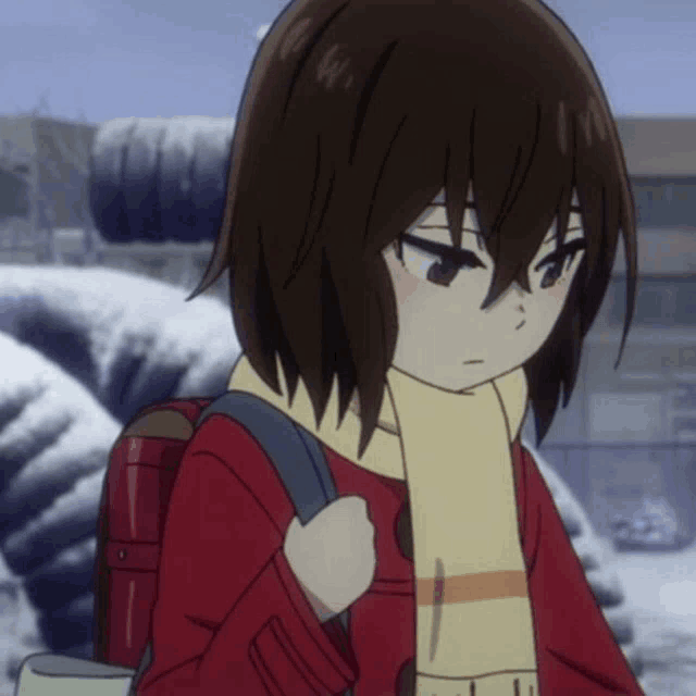a girl with a scarf around her neck is wearing a red coat