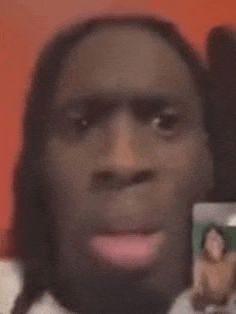 a man is making a funny face while talking on a video call .