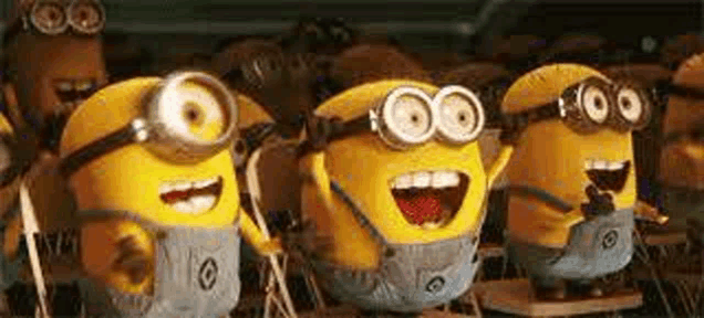 a group of minions are standing next to each other with their mouths open and laughing .