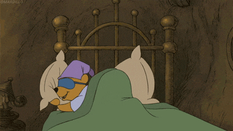 a cartoon of winnie the pooh wearing sleeping glasses