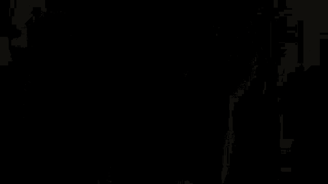 a man without a shirt is wearing a bra made of seashells