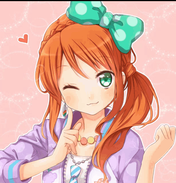 a girl with red hair and green eyes is wearing a green bow