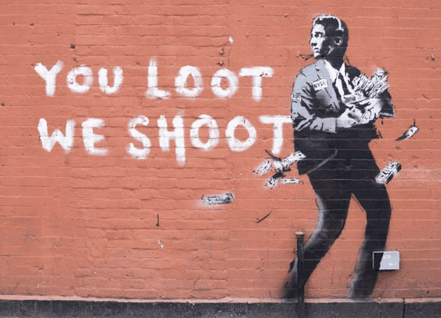 a brick wall with a painting of a man holding money and the words " you loot we shoot "