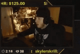 a man wearing headphones and a hat is on a screen with the name skylerskrillz on it