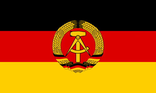 a black red and yellow flag with a hammer and compass in the middle