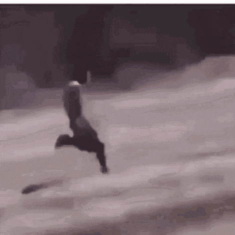 a person is flying through the air on a snowboard in the snow .