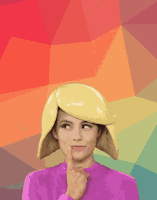 a woman wearing a yellow hat is thinking of you wishing you the best