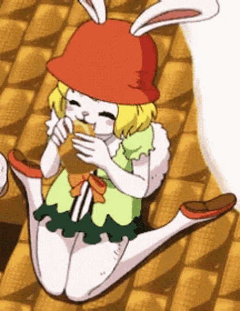 a girl with bunny ears is eating a sandwich