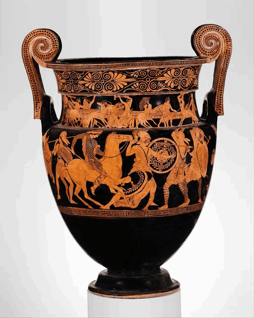 a black and red vase with a swirl handle and a greek inscription on it