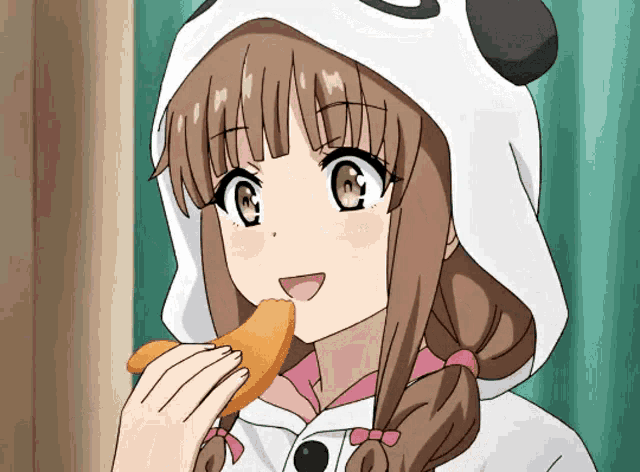 a girl wearing a panda hoodie is eating something