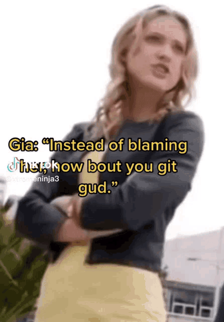 a woman in a black jacket and yellow skirt says gia instead of blaming her how bout you git gud