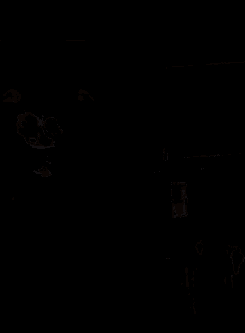 a close up of a dog 's face with its tongue out in a living room .