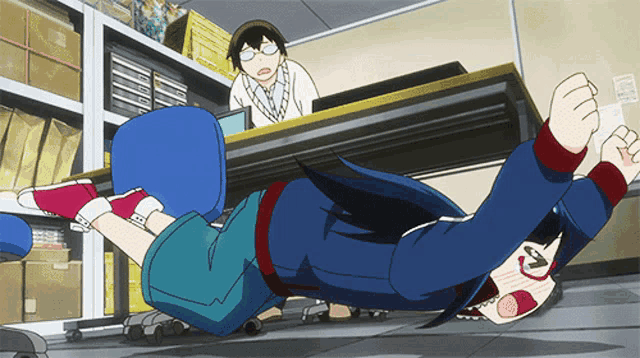 a person is laying on their back on the floor while a man looks on