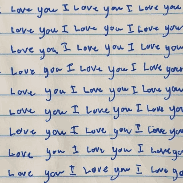 a blue piece of paper with the words " i love you " written on it