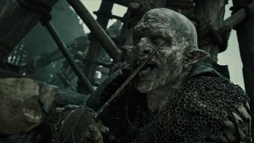 a monster with a knife in its mouth