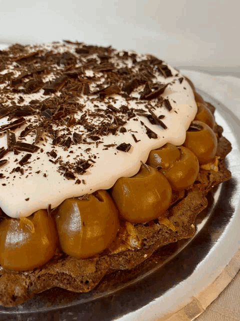 a pie with chocolate shavings on top of it