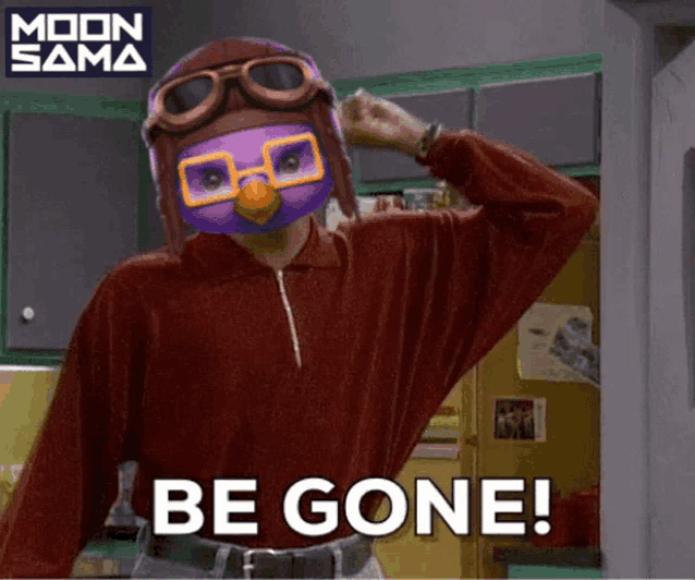 a man wearing a purple helmet and goggles says " be gone "