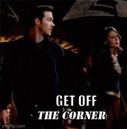 a man and woman are standing under an umbrella with the words get off the corner