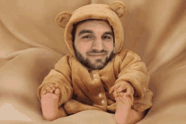 a man with a beard is wearing a teddy bear onesie