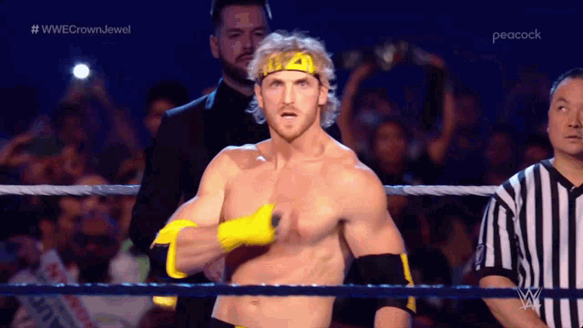 a shirtless wrestler is in a wrestling ring with a peacock logo in the corner