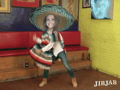 a woman wearing a sombrero and a poncho is dancing in a room with jibjab written on the bottom