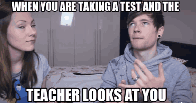 a man and a woman are standing next to each other with a caption that says when you are taking a test