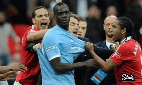 a group of soccer players are having a fight on the field .