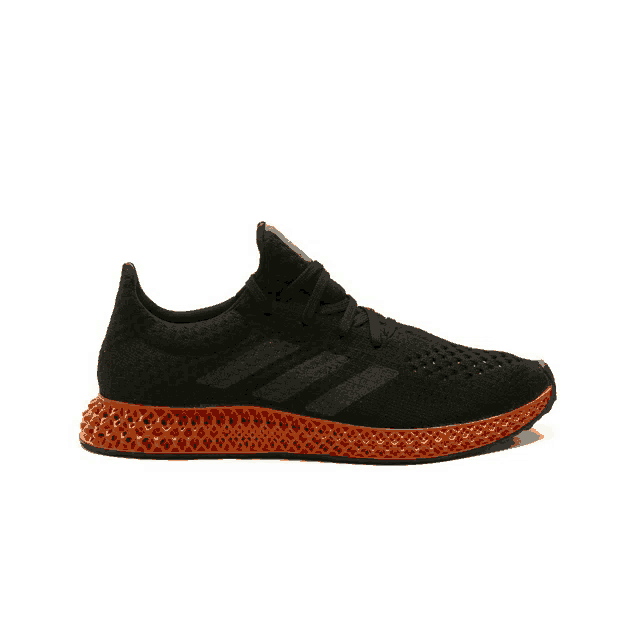 a pair of black and orange adidas running shoes on a white background