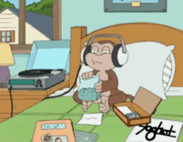 a cartoon monkey is sitting on a bed wearing headphones and holding a cup .