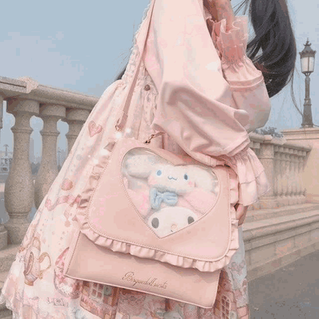 a woman in a white dress is holding a white stuffed animal with red eyes