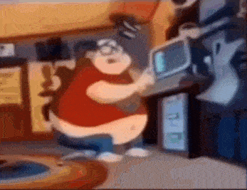 a fat man is playing a video game on a computer in a room .