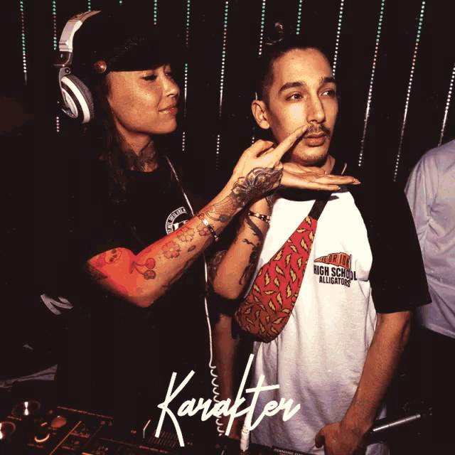 a man wearing a shirt that says high school all-stars is being touched by a woman