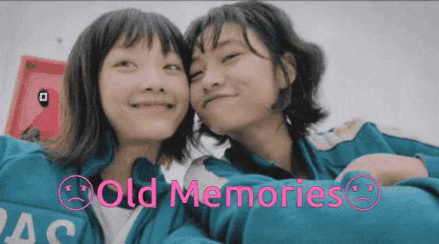 two girls are posing for a picture with the words old memories written below them