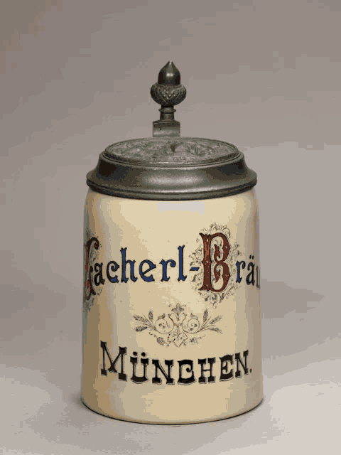 a ceramic jar with a lid that says cacherl-brau munchen