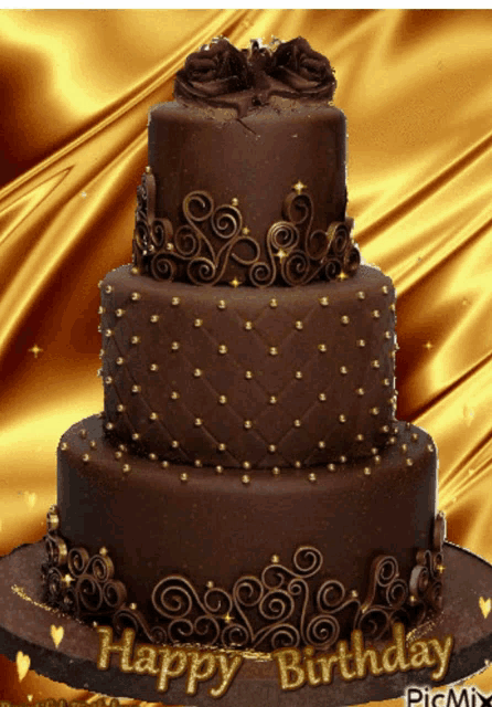 a three tiered chocolate birthday cake with the words happy birthday written on it