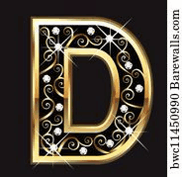 the letter d is decorated with swirls and diamonds on a black background .