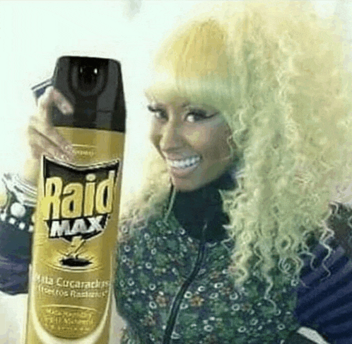 a blonde woman is holding a bottle of raid max